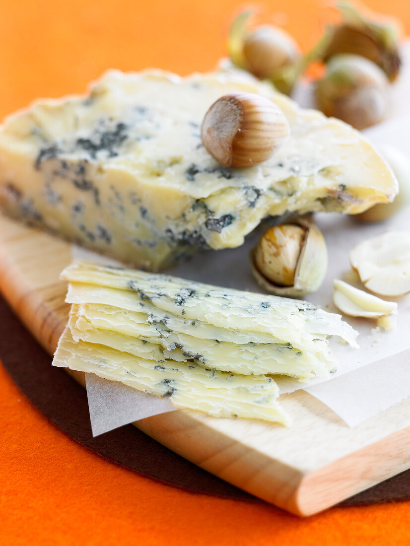 Thinly sliced blue cheese with hazelnuts