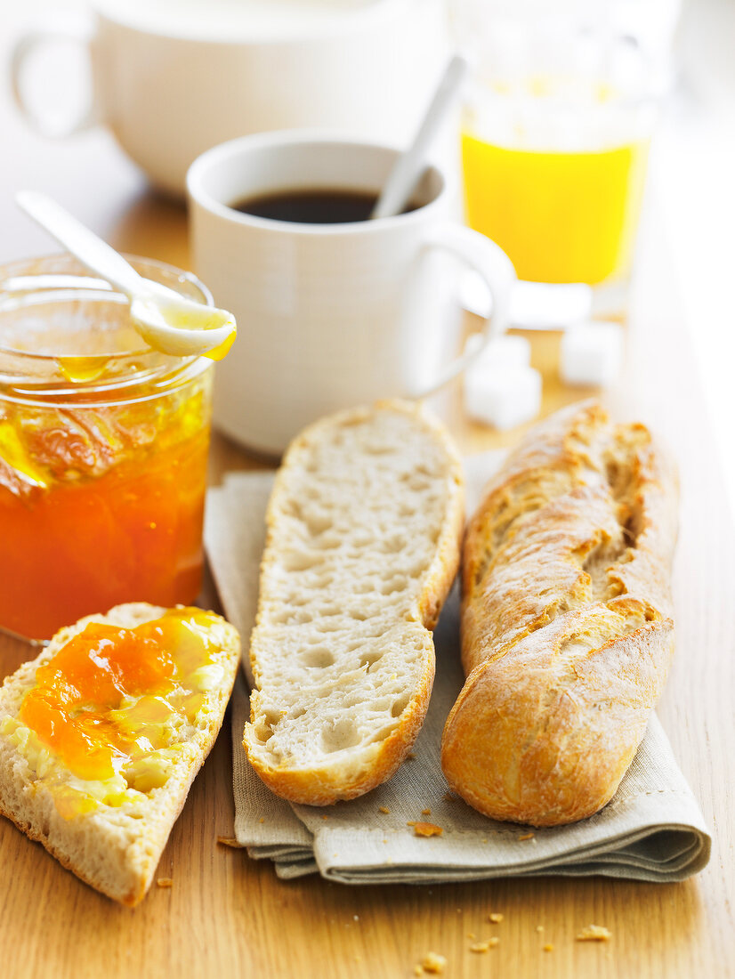 Breakfast with coffee,orange juice ,bread and jam