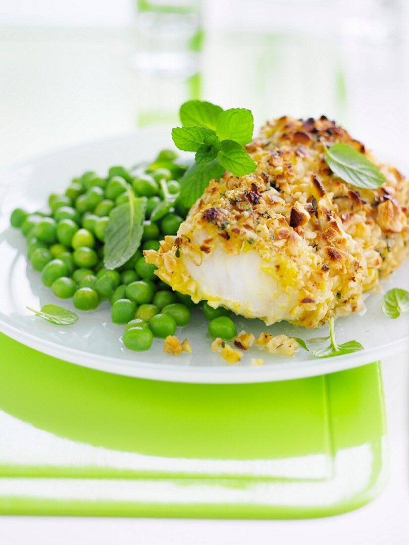 Cod coated in crushed hazelnuts and peas with mint and basil
