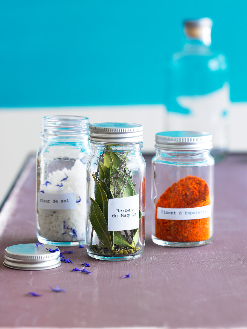 Small jars of spices and dried herbs