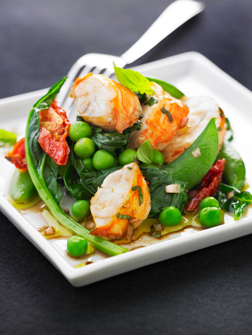 Spiny lobster tail,pea,spinach sun-dried tomato and sugar pea salad