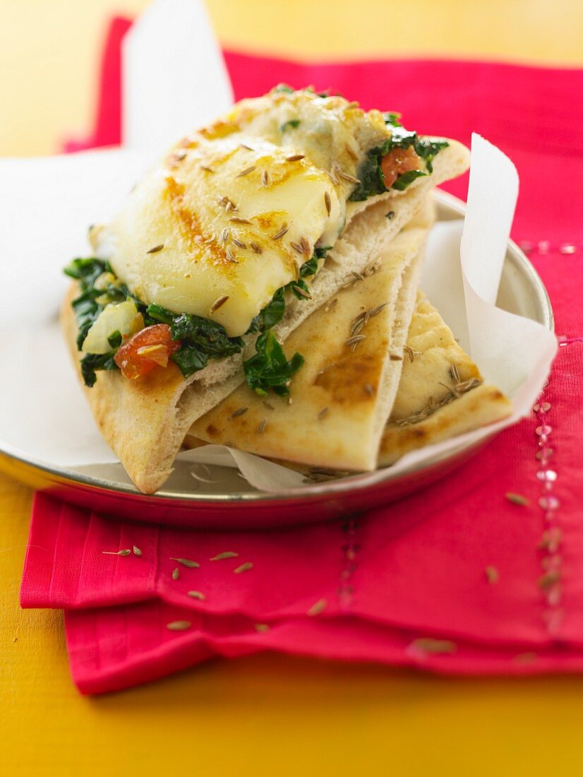 Pitta bread with spinach melted Cabécou and fennel seeds