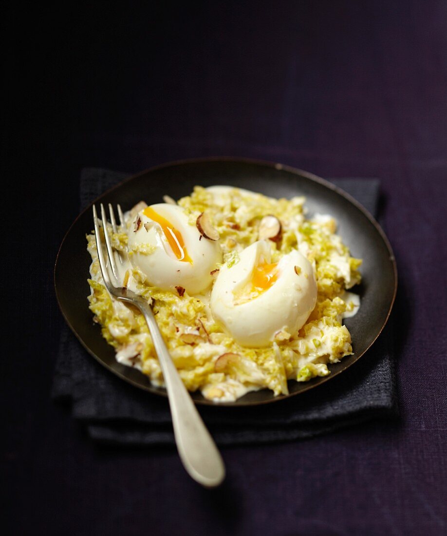Braised green cabbage with hazelnuts and soft-boiled eggs