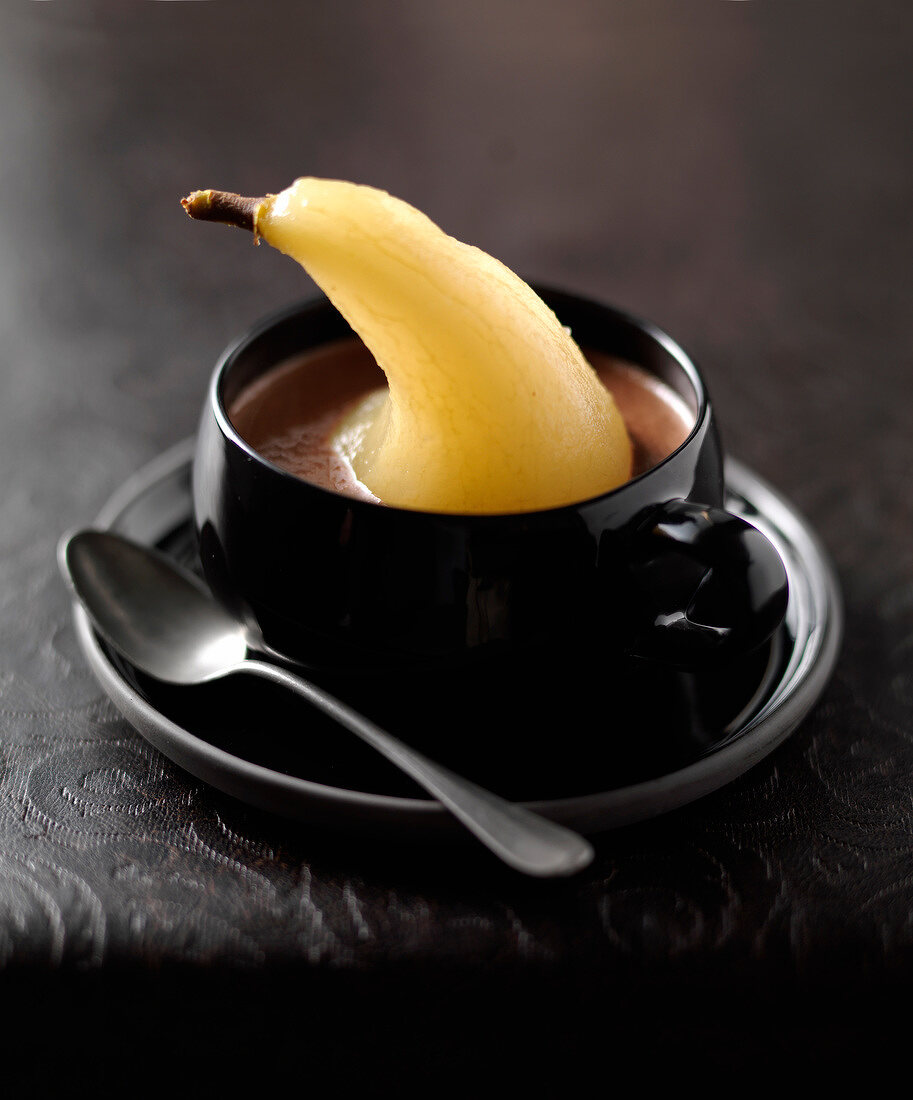 Chocolate soup with a poached pear