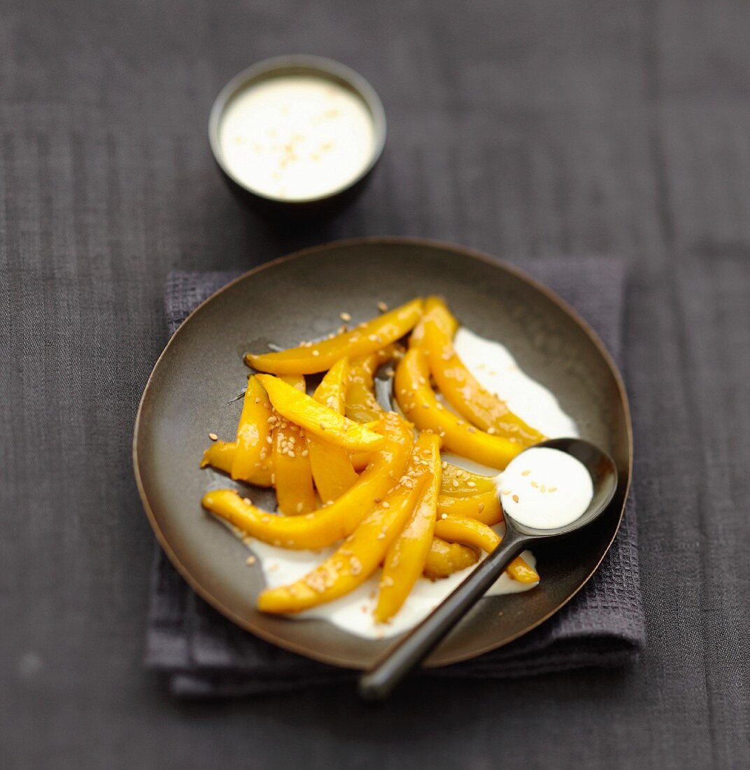 Roasted mango with coconut and sesame cream