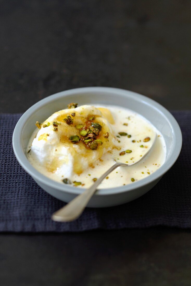 Beaten egg whites in cream with pistachios