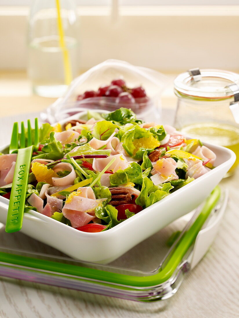 Mixed salad with ham and pecans