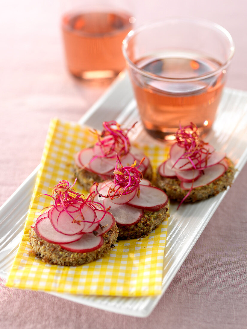 Radishes on sliced brown bread