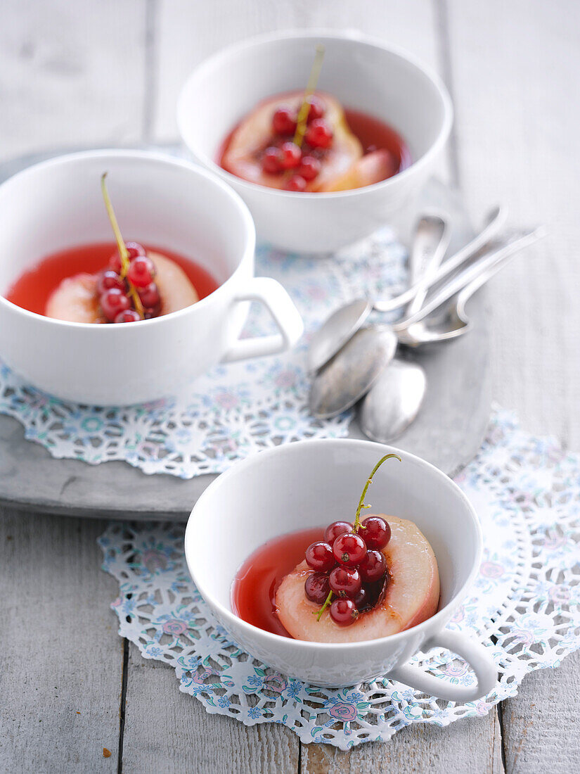 Poached nectarines with redcurrant syrup