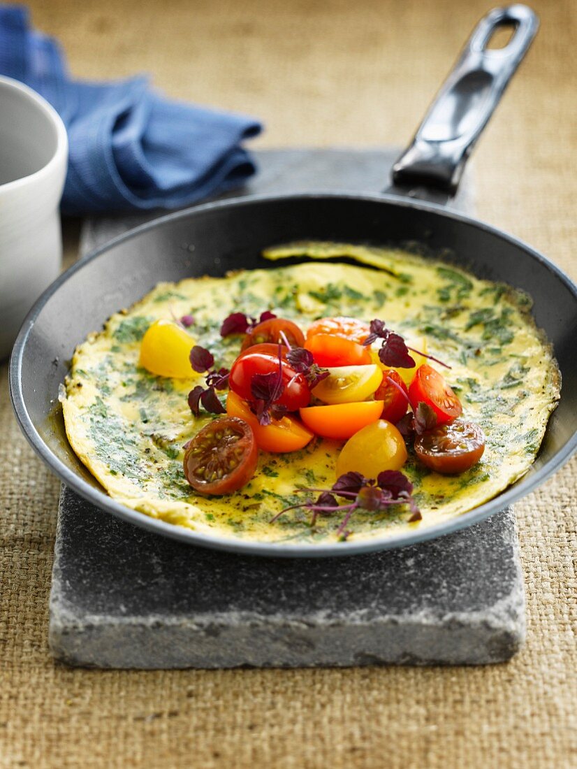 Herb omelette with cherry tomatoes