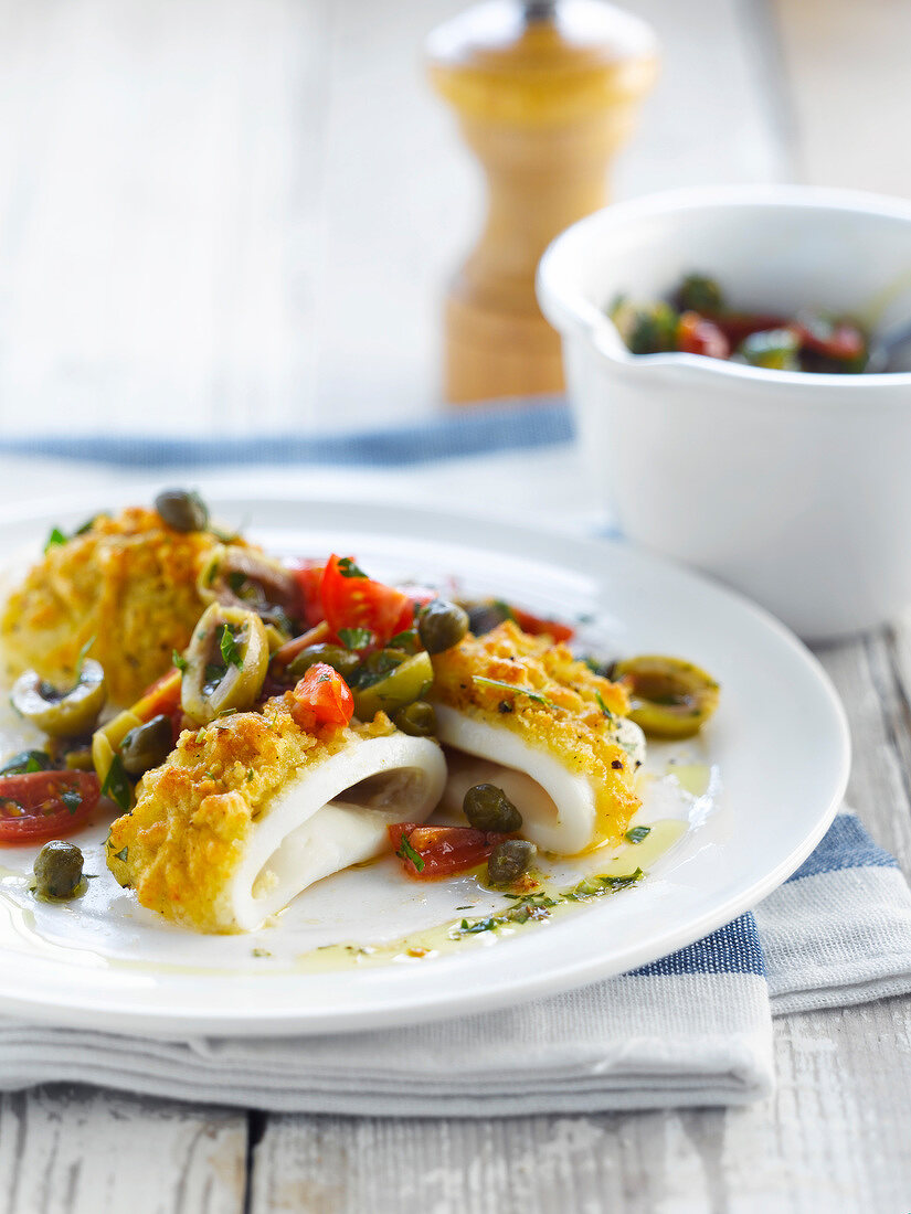 Breaded squid with capers,olives and tomatoes