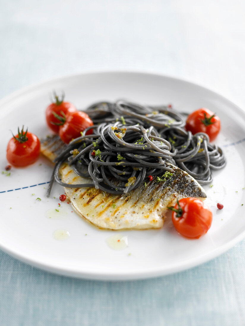 Grilled sea bass and squid ink spaghetti