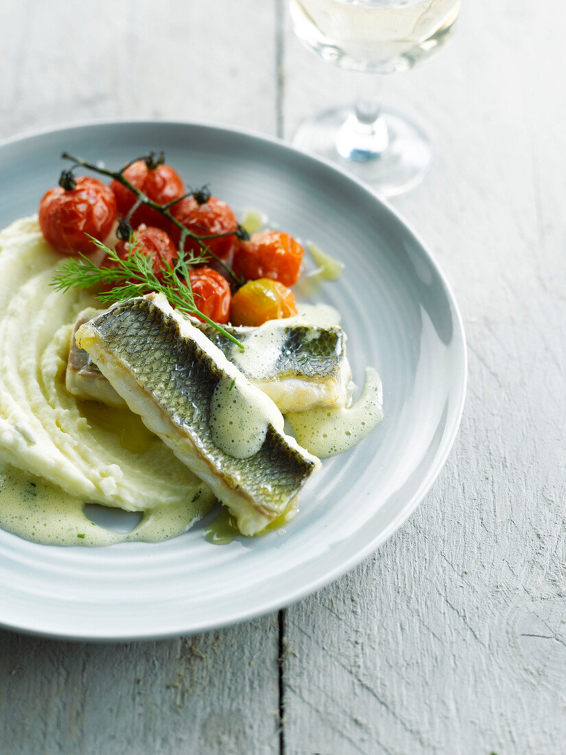 Salt bass cooked in salt crust,foamy lemon sauce,mashed potatoes and cherry tomatoes