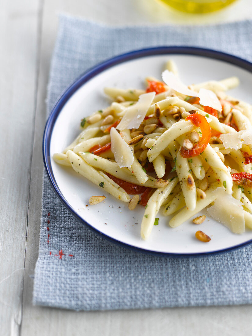 Pasta with sun-dried tomatoes,basil,parmesan and pine nuts