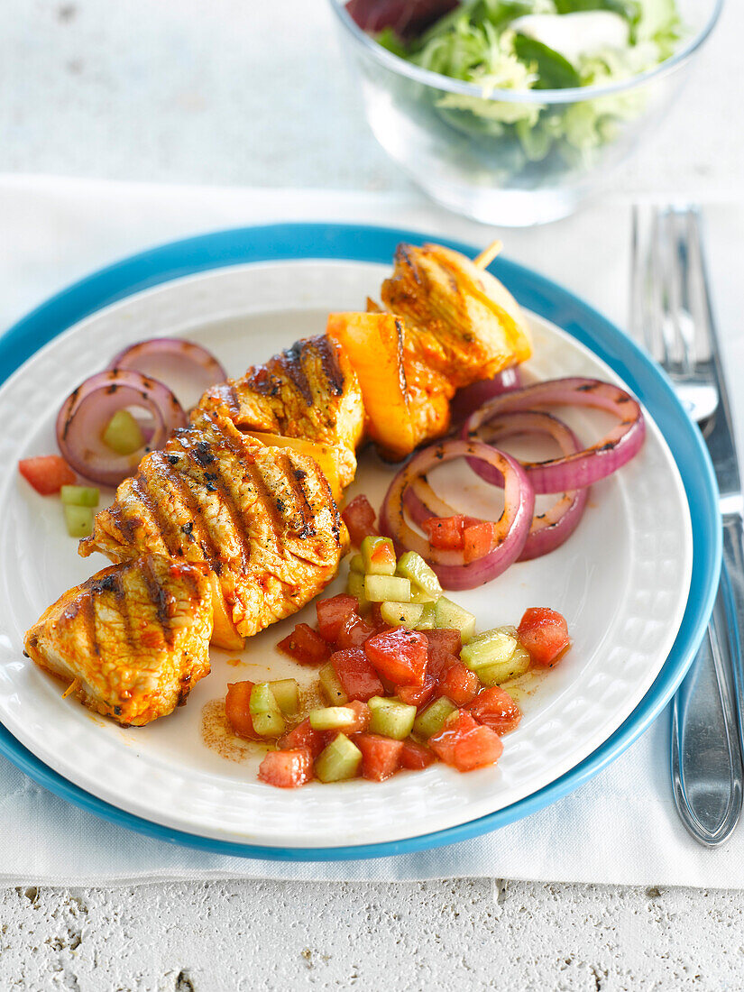 Curried turkey brochettes with cucumber and tomato summer salad