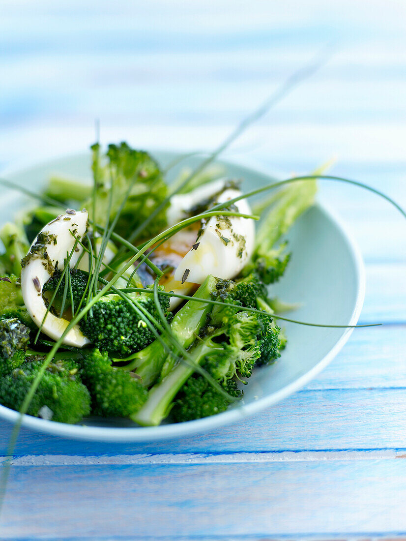Broccoli salad with a soft-boiled egg and tarragon oil
