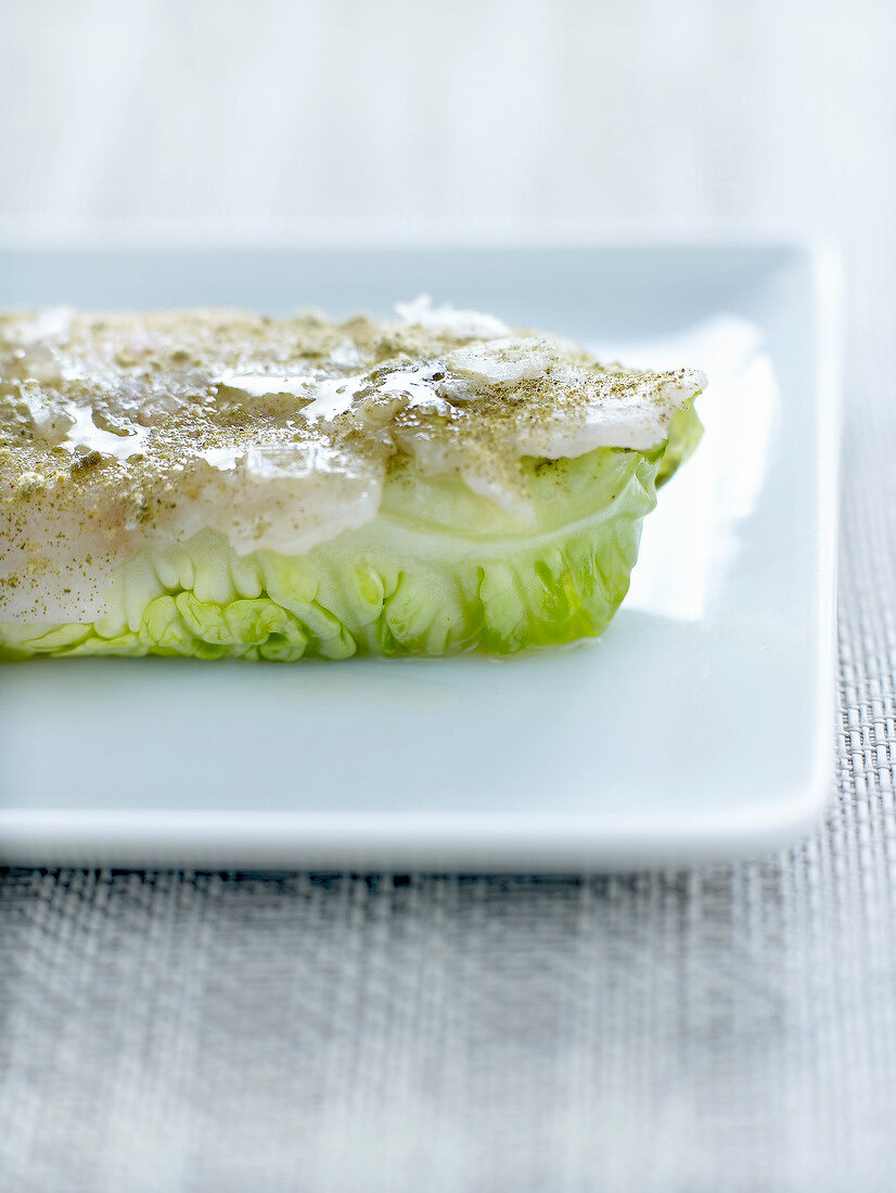 Bass and lettuce bite sprinkled with green tea powder