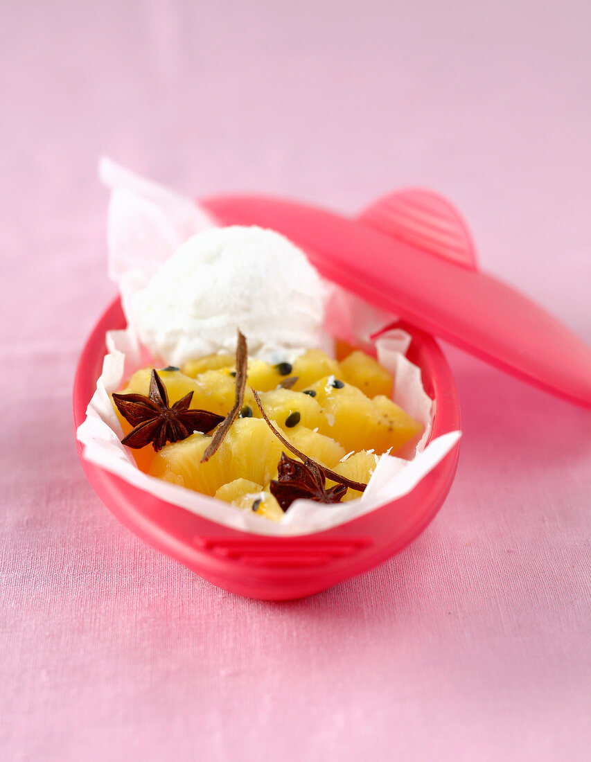 Spicy fruit cooked in wax paper and served with ice cream