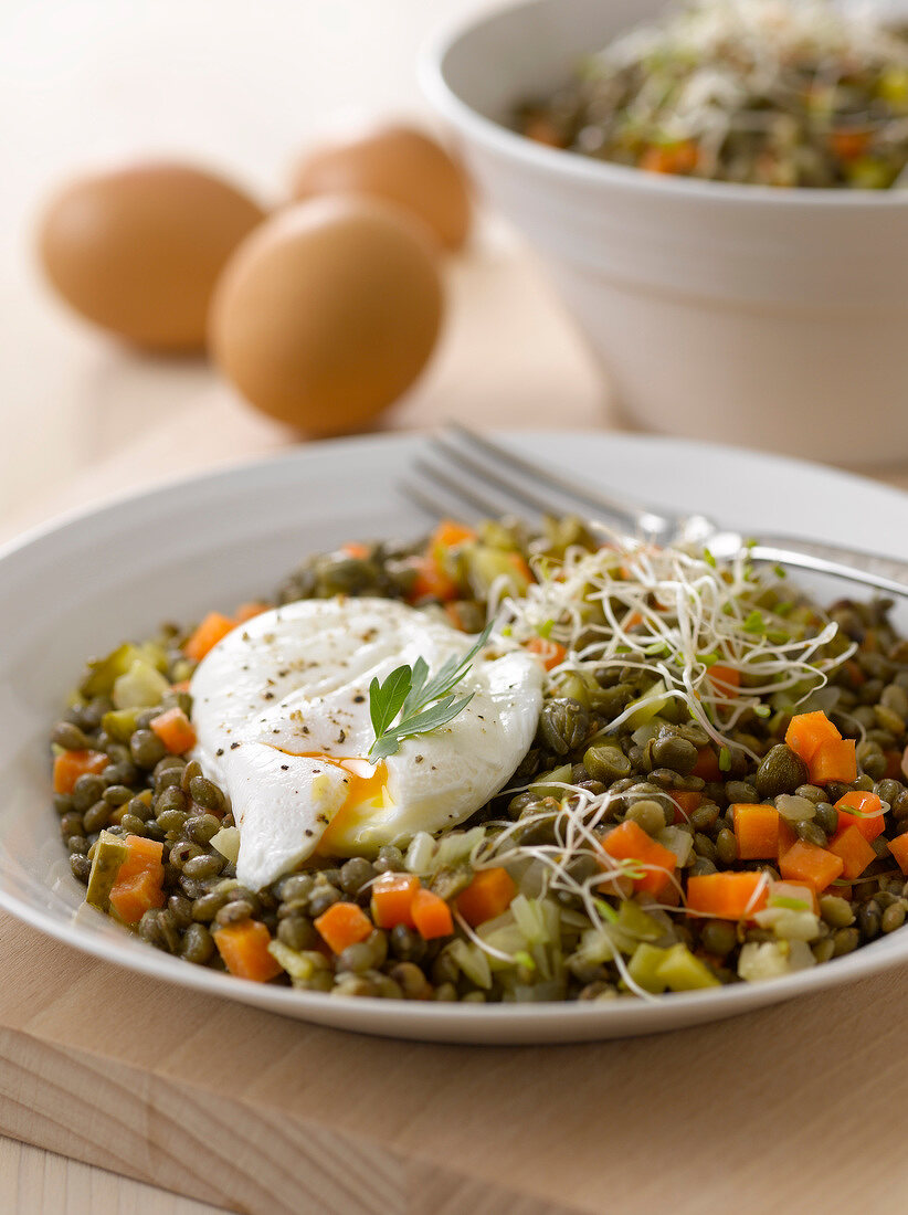 Lentil salad with capers and a poached egg