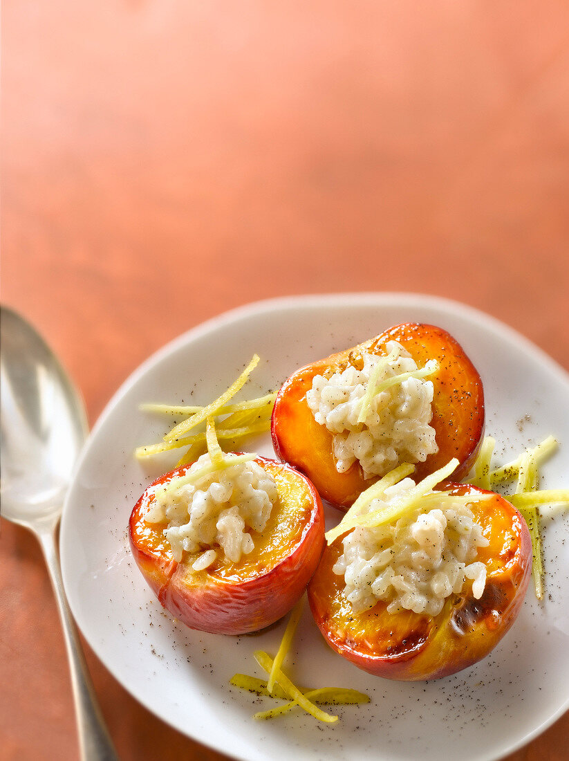 Roasted nectarines garnished with ginger-flavored rice pudding