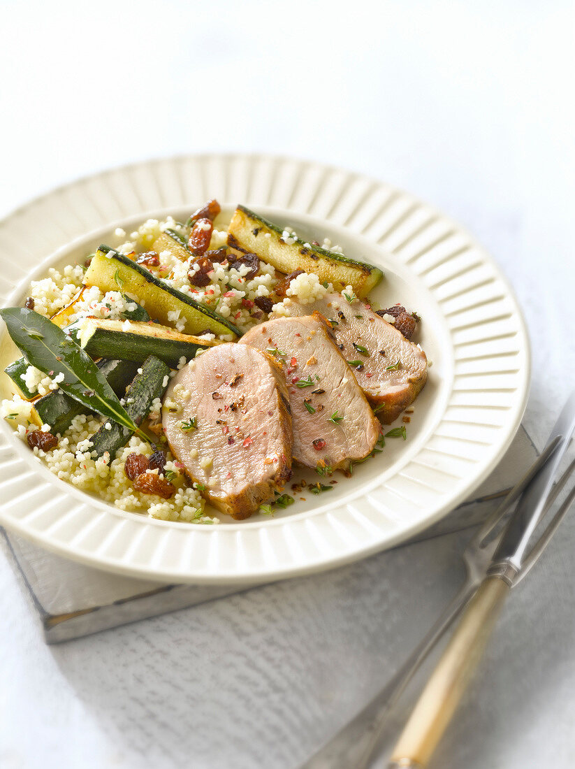 Pork filet mignon with semolina, zucchinis and raisins