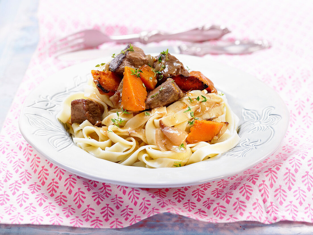 Beef and pumpkin stew with tagliatelles