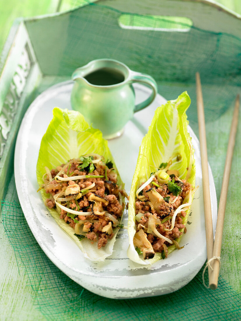 Sang choy bow, pork with shiitakes in lettuce leaves