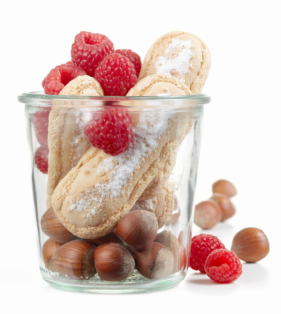 Raspberries,hazelnuts and finger biscuits in a jar
