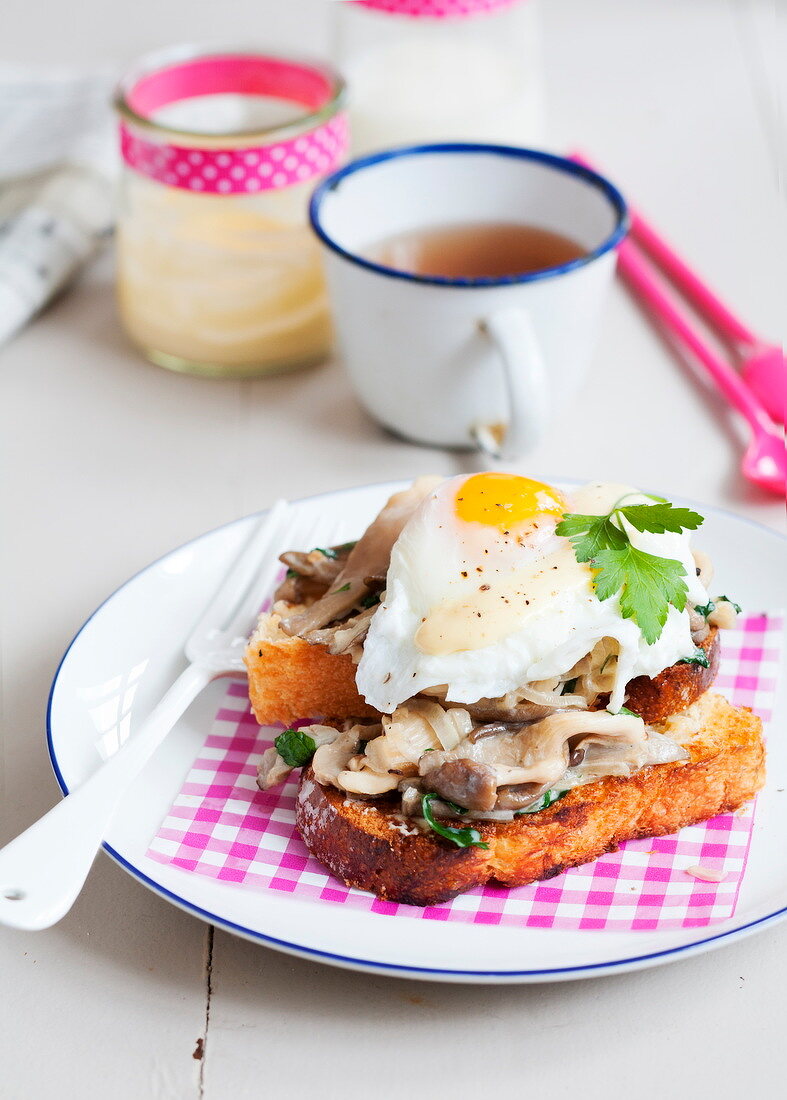 Fried egg and mushrooms on toasted brioche