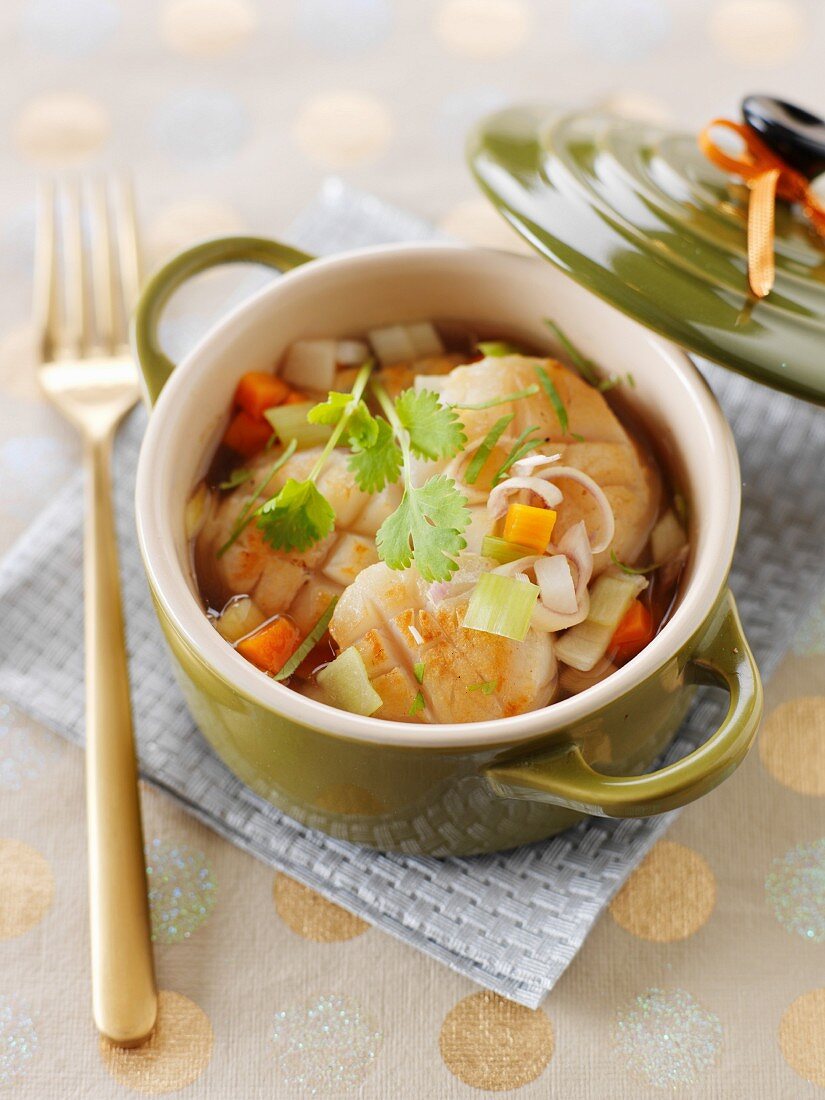 Small casserole dishes of scallops with citronella, star anise and smoked tea