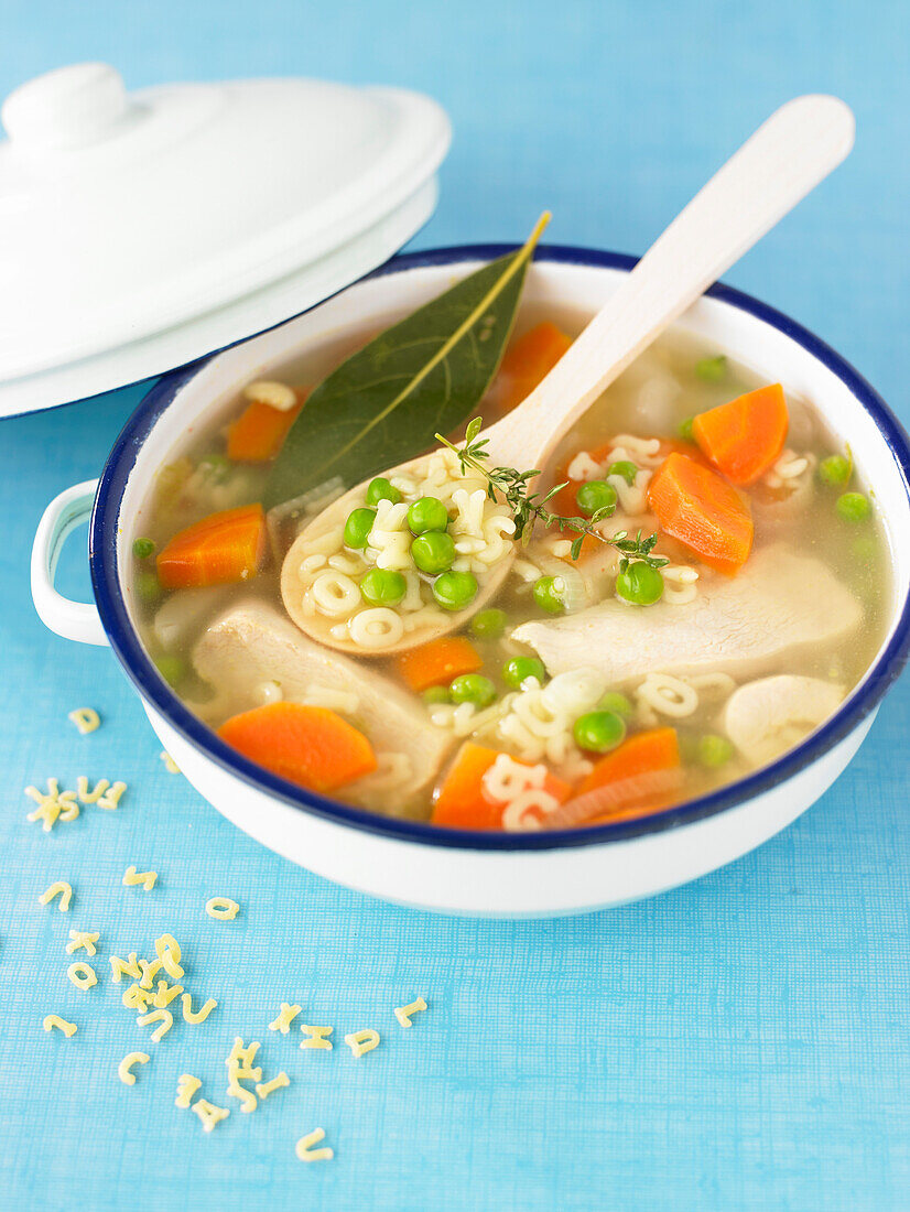 Chicken broth with vegetables and alphabet pasta