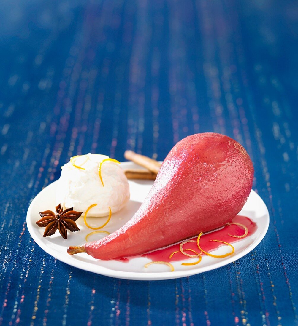 Pear poached in spicy red wine with ice cream