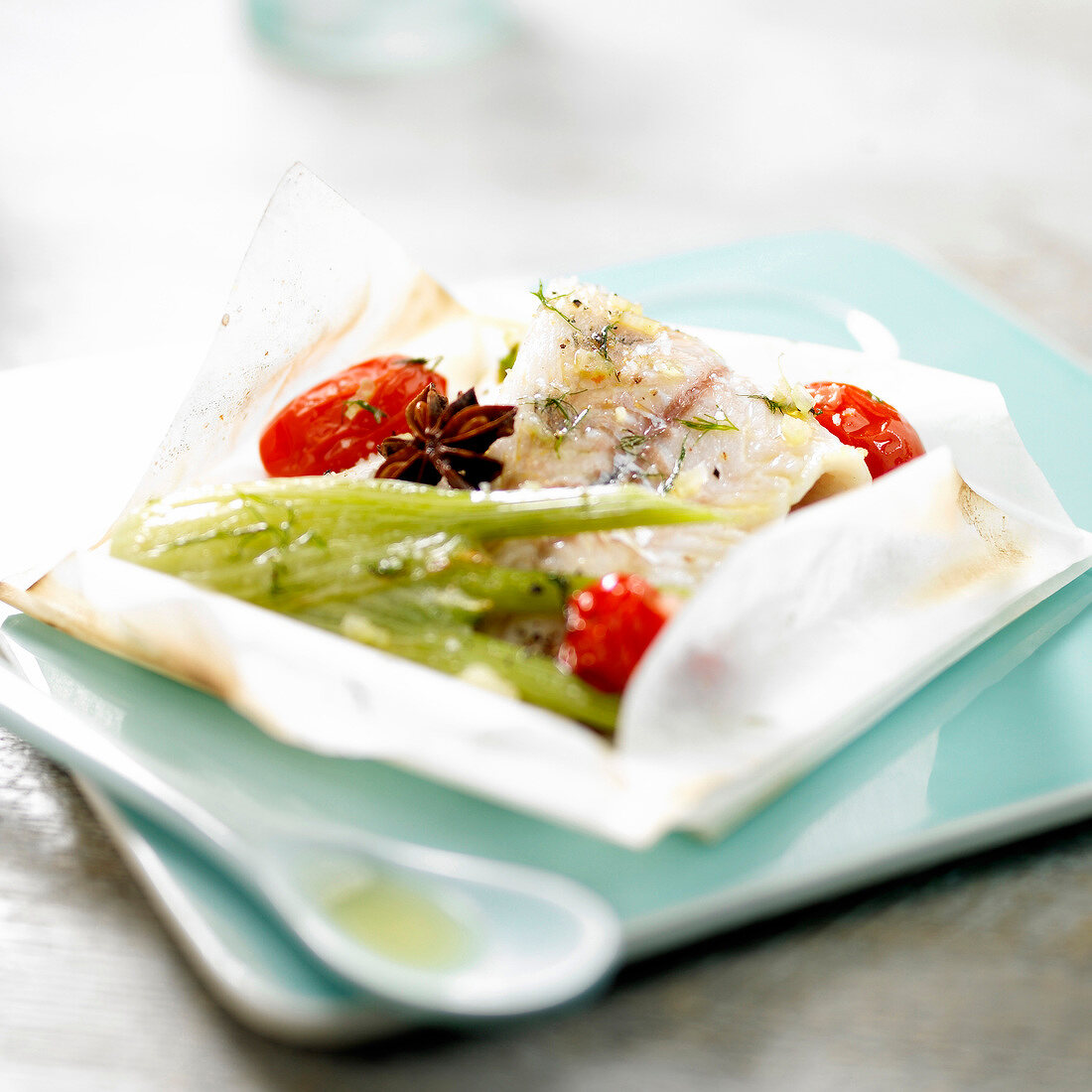 Pike-perch with star anise,fennel and tomatoes cooked in wax paper