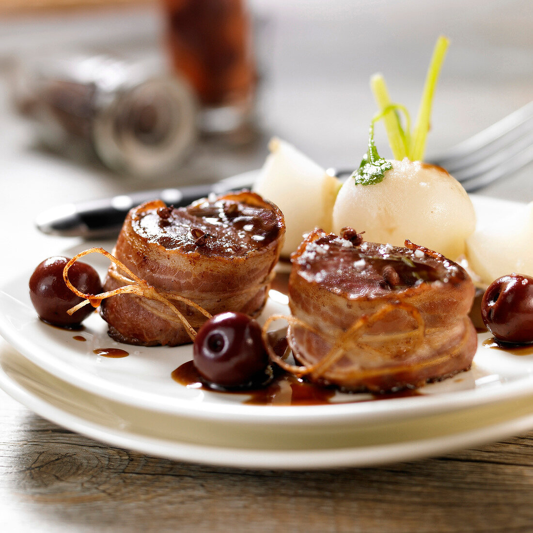 Doe Tournedos wrapped in bacon with cherries