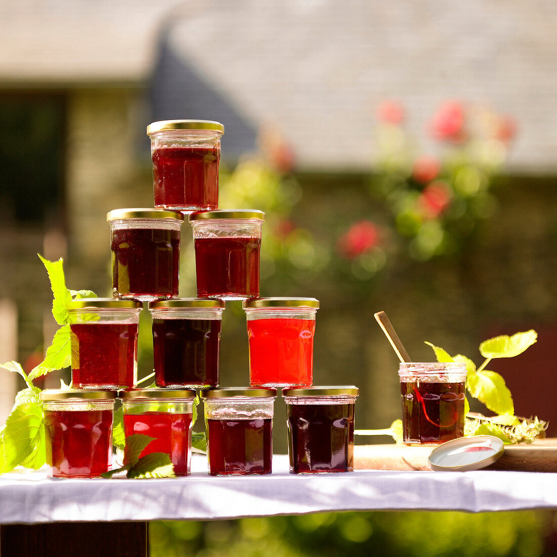 Pyramid of summer fruit jelly in jars