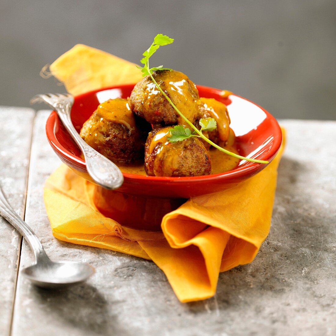 Meatballs in coconut and curry sauce