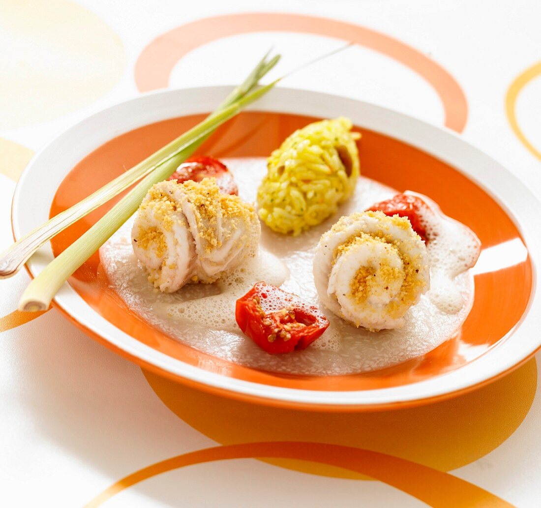 Rolled sole fillets coated in crushed peanuts, citronella emulsion and rice with seafood