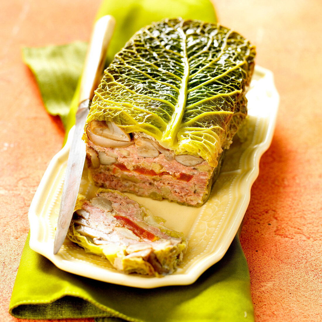 Rabbit and vegetable terrine wrapped in cabbage leaves