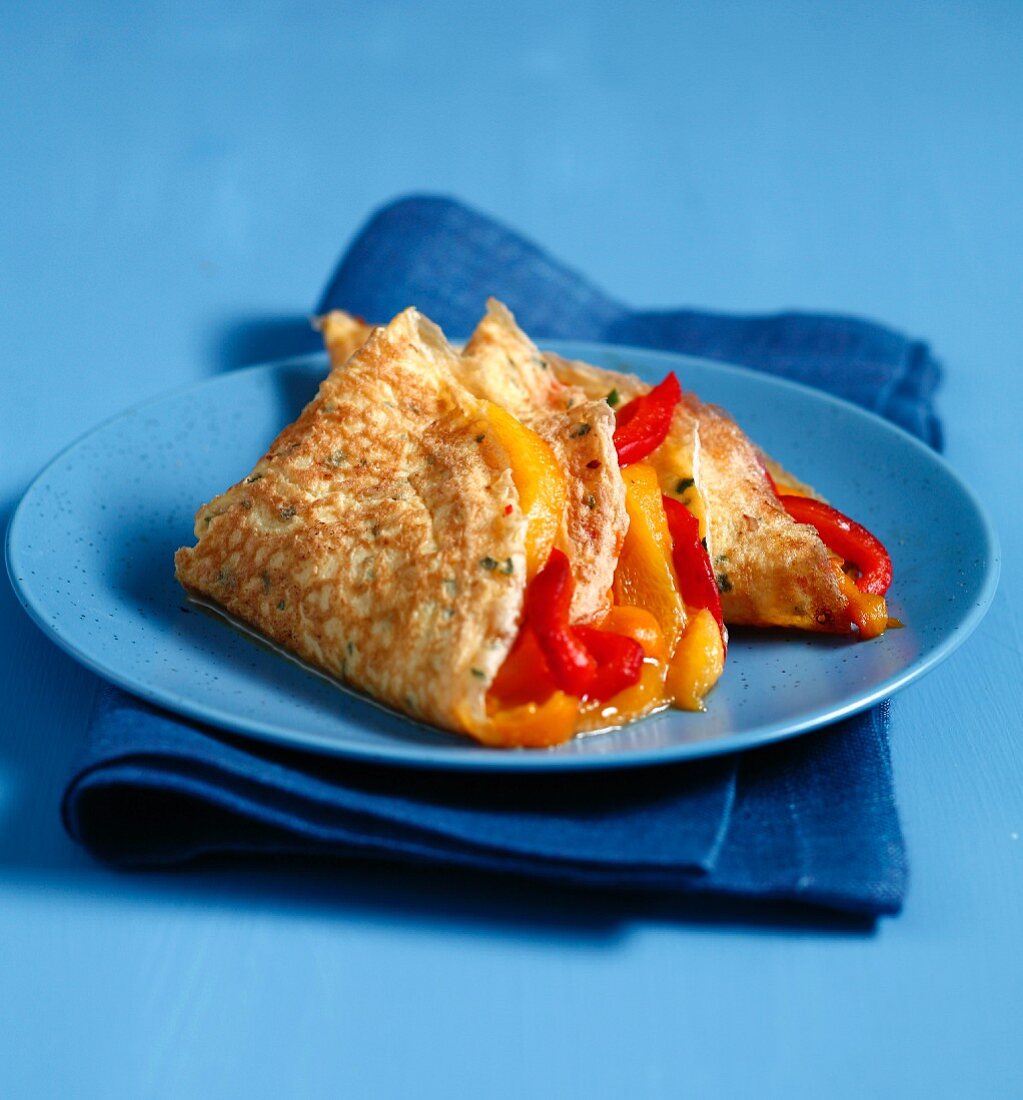 Stuffed omelette with red and yellow peppers