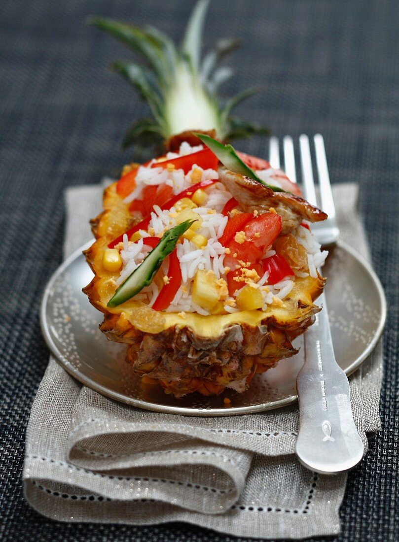 Exotic rice salad served in half a pineapple