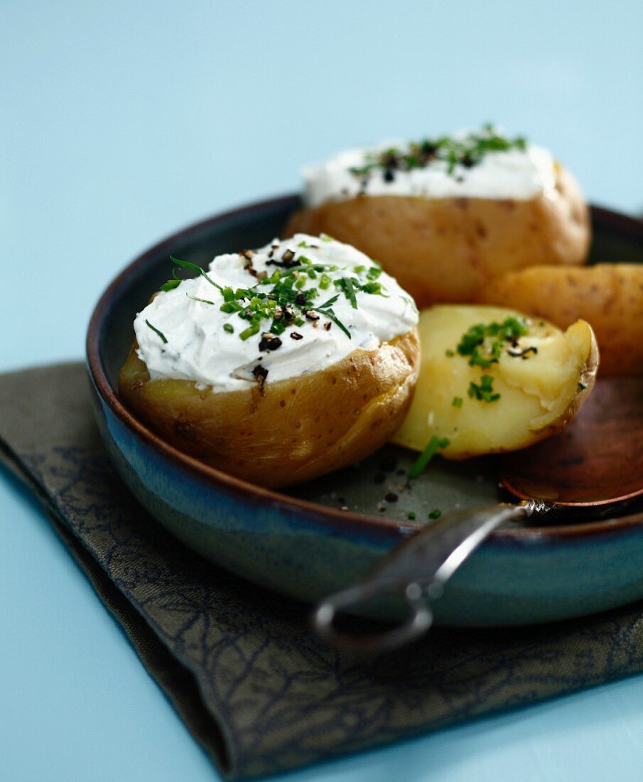 Oven-baked potatoes with fromage blanc and herbs