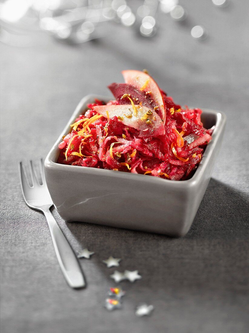 Grated raw apple and beetroot salad in aniseed-flavored orange juice