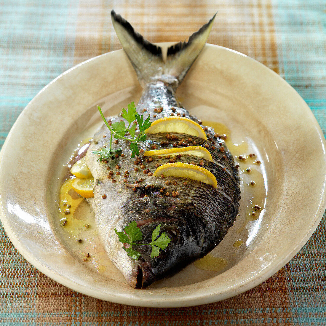Oven-baked sea bream with lemon and coriander seeds