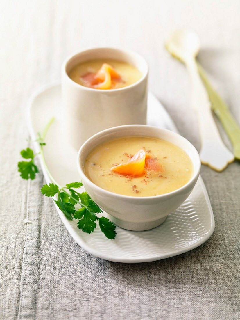Cream of orange lentil soup with flaked salmon