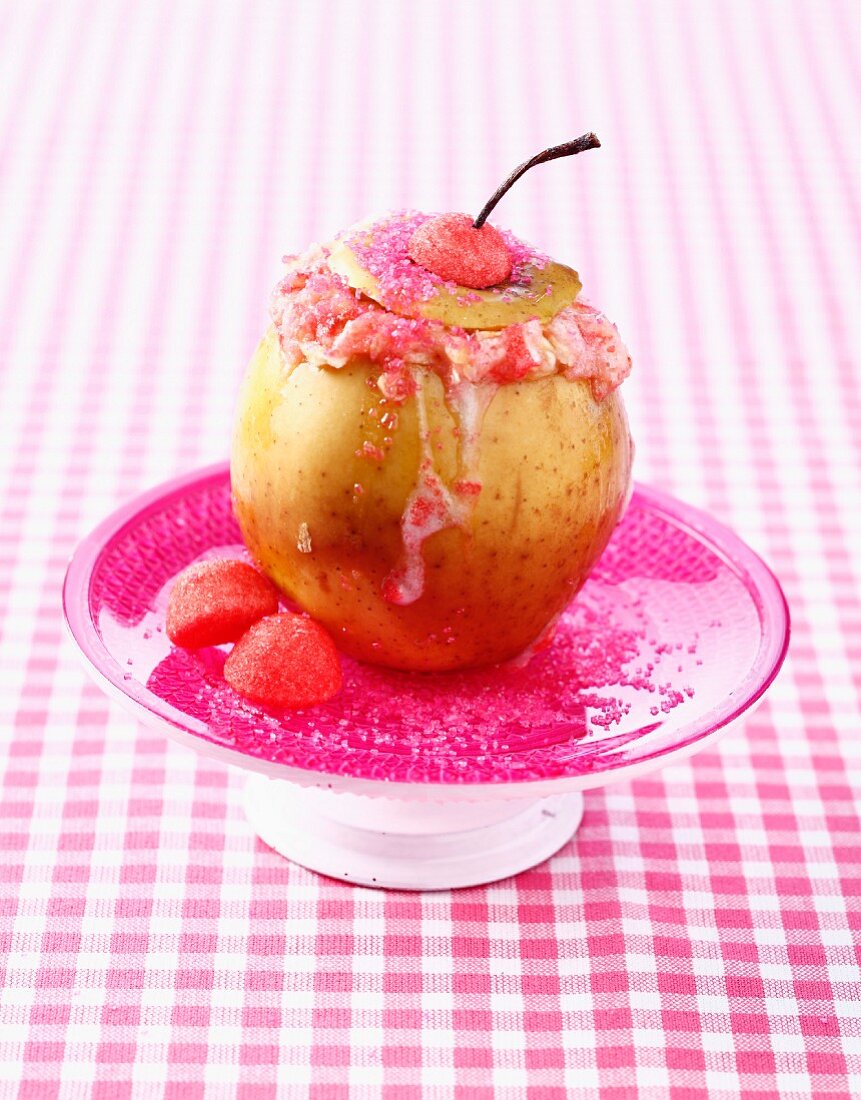 Baked apple stuffed with cotton candy and Tagada strawberry candies