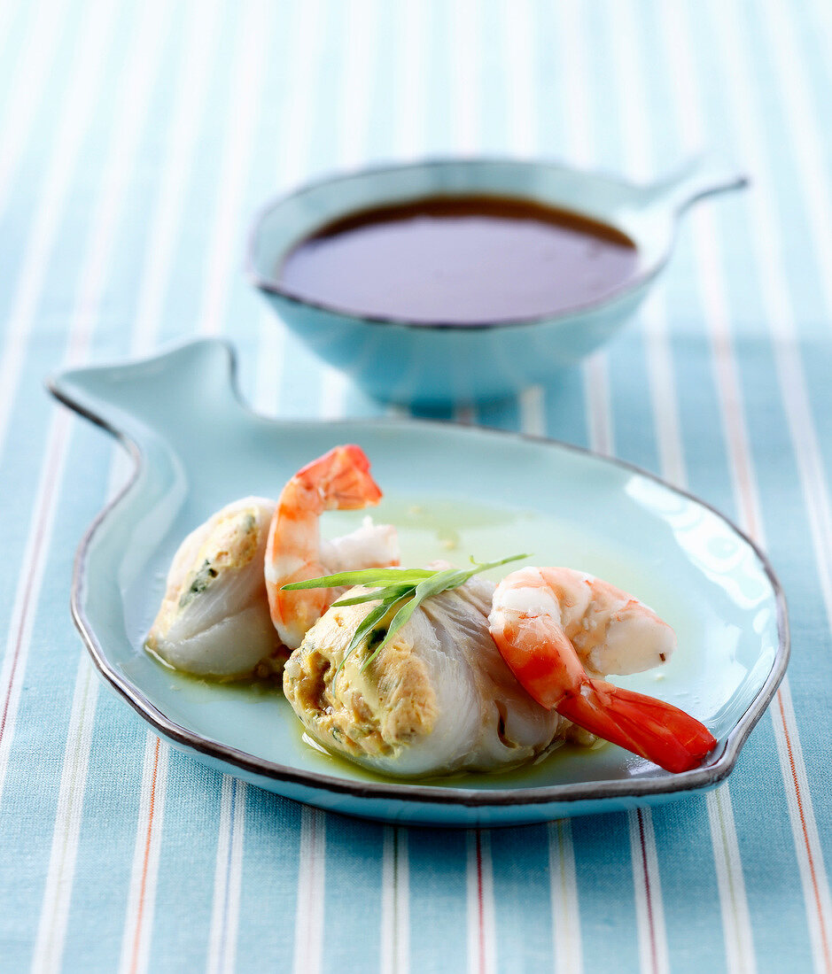 Rolled salmon fillets stuffed with salmon, shrimps and tarragon