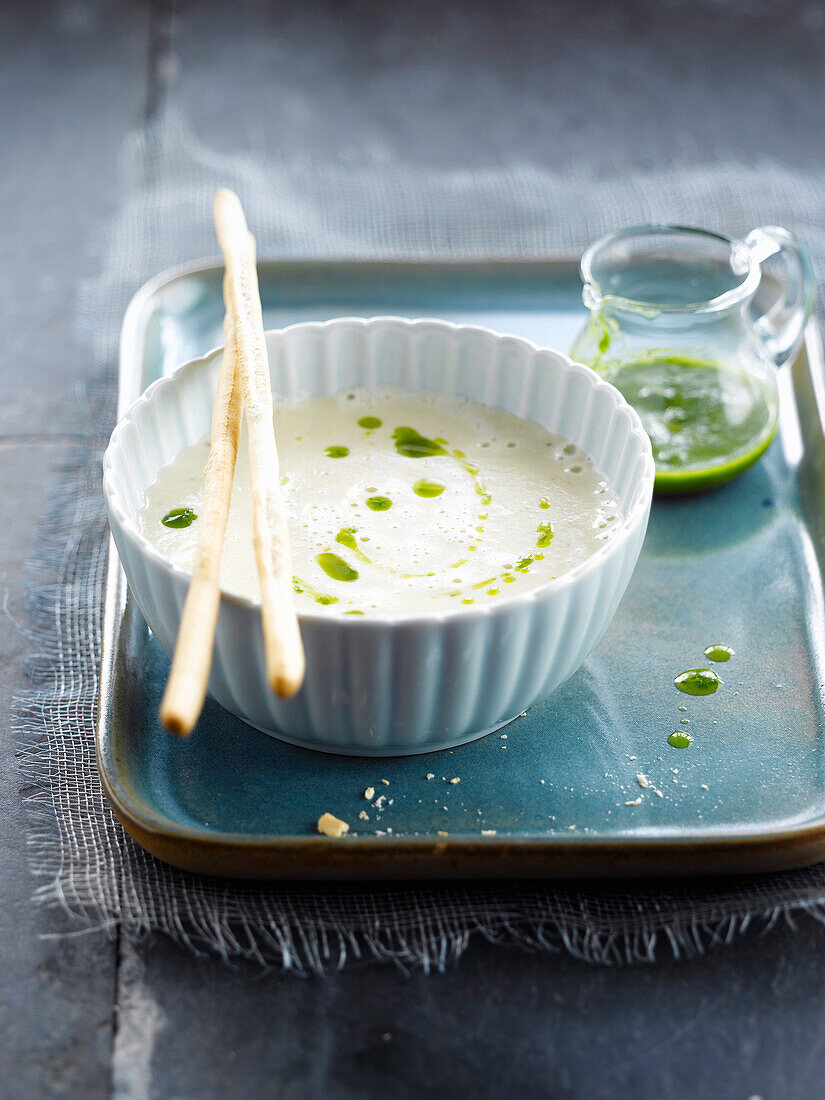 Cream of artichoke soup with herb puree