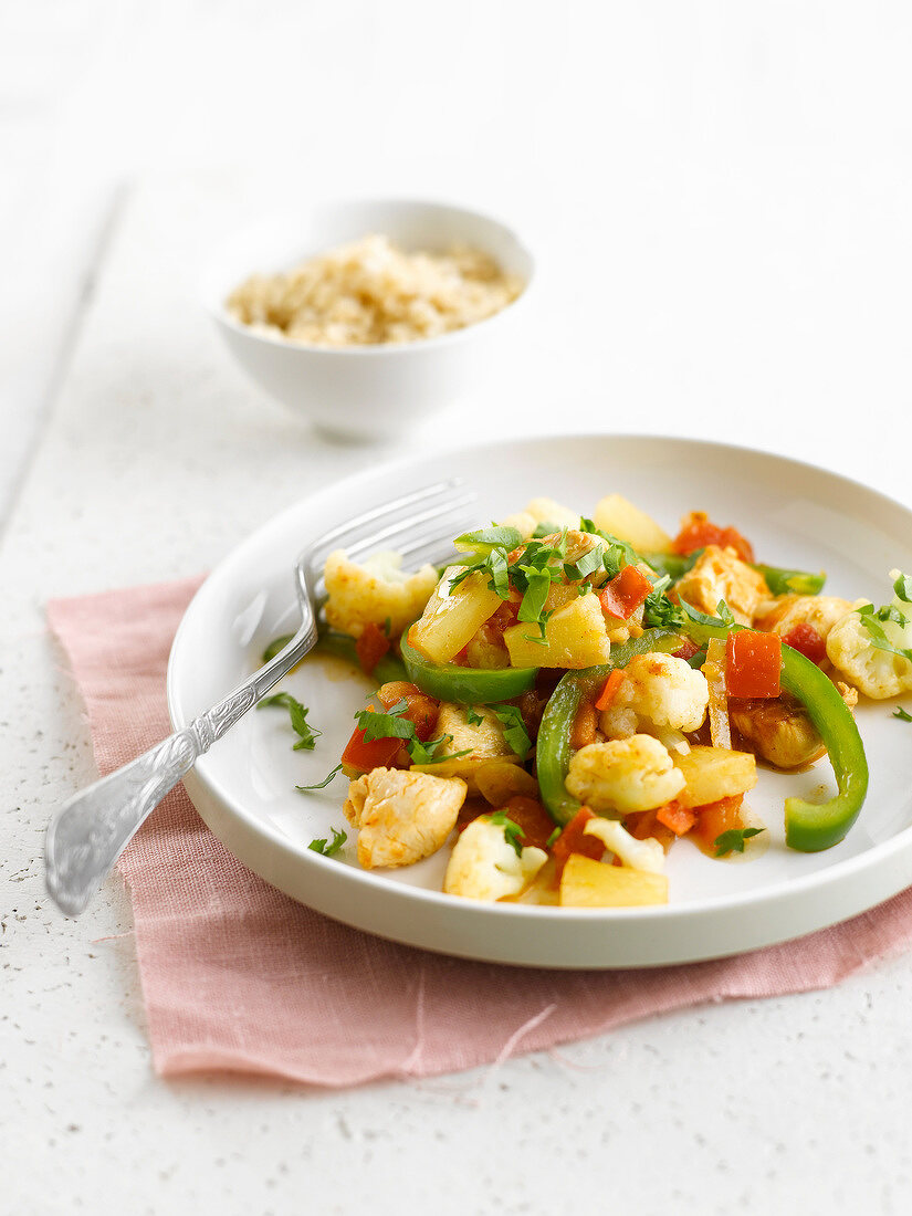 Asian-style chicken with cauliflower,peppers and pineapple