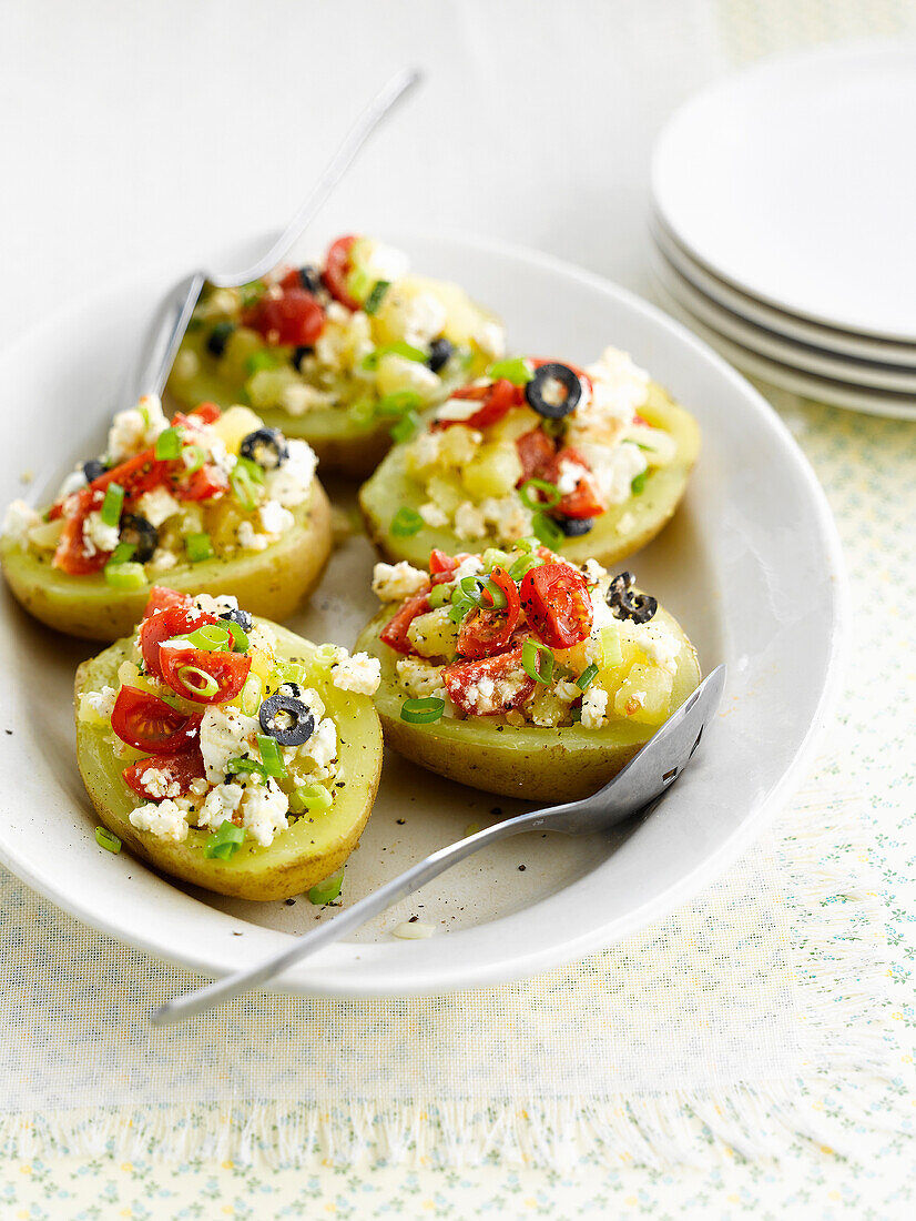 Jacket potatoes with tomatoes and feta