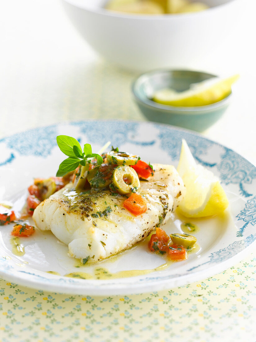 Cod with green olives and tomatoes